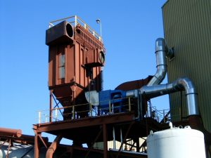 A large industrial type of machine on top of a building.