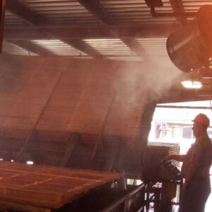 Probe America Misting Fan A man standing in front of an oven.