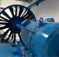 Comprehensive Testing A blue electric motor and fan in an industrial setting.